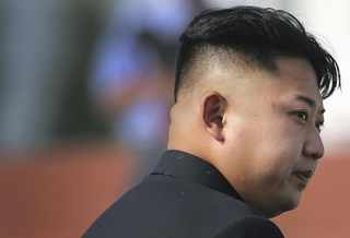 N. Korea's Kim Inspects New Submarine, Signals Missile Development