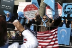 Uighurs and their supporters rally across the street from United Nations headquarters in New York, Thursday, March 15, 2018. Members of the Uighur Muslim ethnic group held demonstrations in cities around the world on Thursday to protest a sweeping Chinese surveillance and security campaign that has sent thousands of their people into detention and political indoctrination centers. (AP Photo/Seth Wenig)