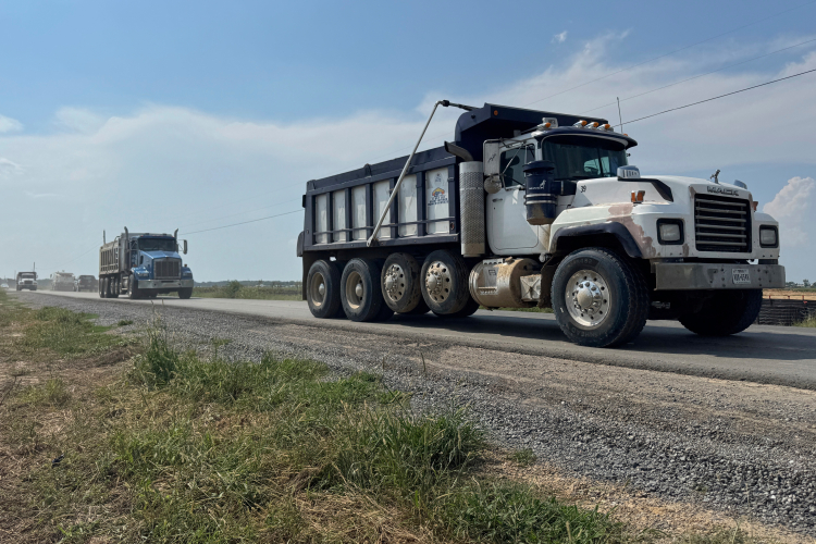 Trucks pass by the site of Meta's Richland Parish Data Center in Holly Ridge, La., AP