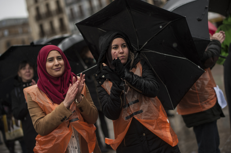 Two muslim demonstrators march in support of refugees and migrants entering Europe, in Pamplona, northern Spain AP
