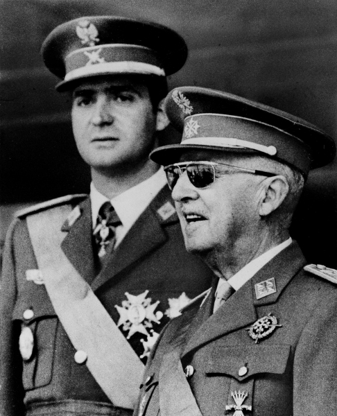Gen. Francisco Franco, right, Spain's 82-year-old leader, is pictured with his handpicked successor, Prince Juan Carlos de Borbon, in 1971, during a ceremony commemorating the 32nd anniversary of Franco's victory in the Spanish Civil War. AP