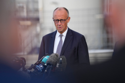 Germany's Merz Vows To Stay On Despite Losses