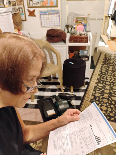 Janet Stechly examines her gas bill in her Washington, PA, home. RCI